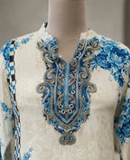Straight kurta with floral prints and checkered side panels.