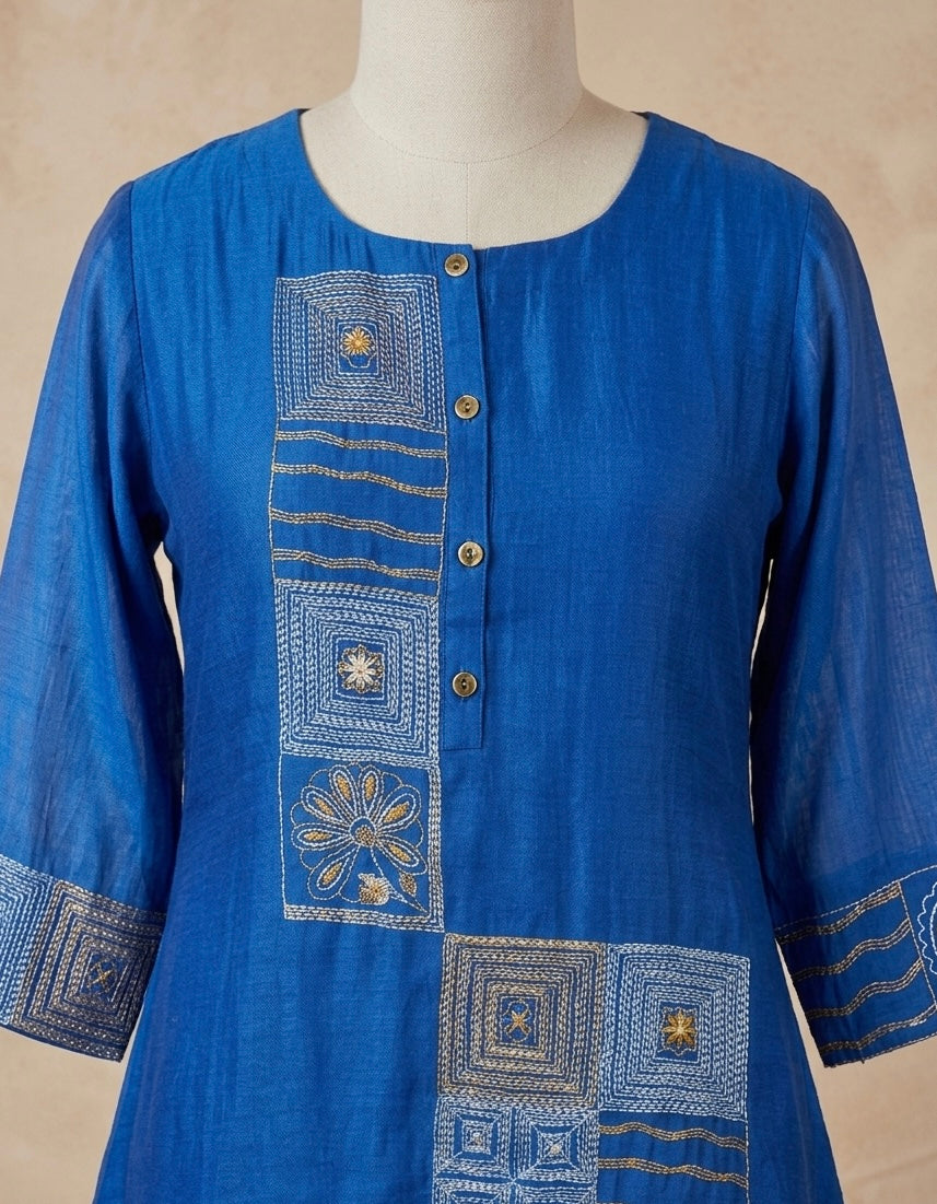 Flared A-line short kurta with matching wide-leg trousers.