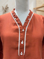 Terracotta Rust V-Neck Kurta Set with Afghani Trousers and Lace Appliqué Detailing