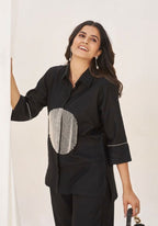 Sophisticated two-piece ensemble that blends minimalist tailoring