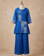 Flared A-line short kurta with matching wide-leg trousers.