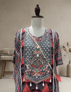 Relaxed kaftan tunic with solid wide-leg trousers.